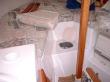 Vee berth storage compartment